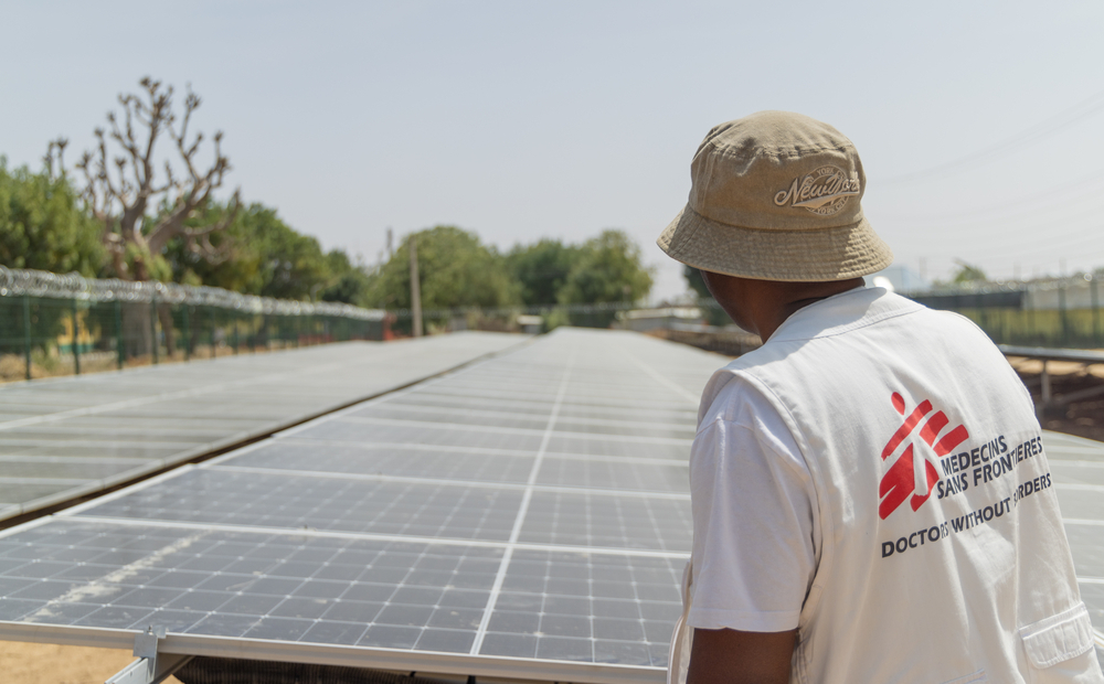 MSF staff inspect the solar panels installed at Zurmi General Hospital in northern Nigeria.